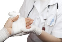 Doctor wrapping hand - Kitsap County medical malpractice